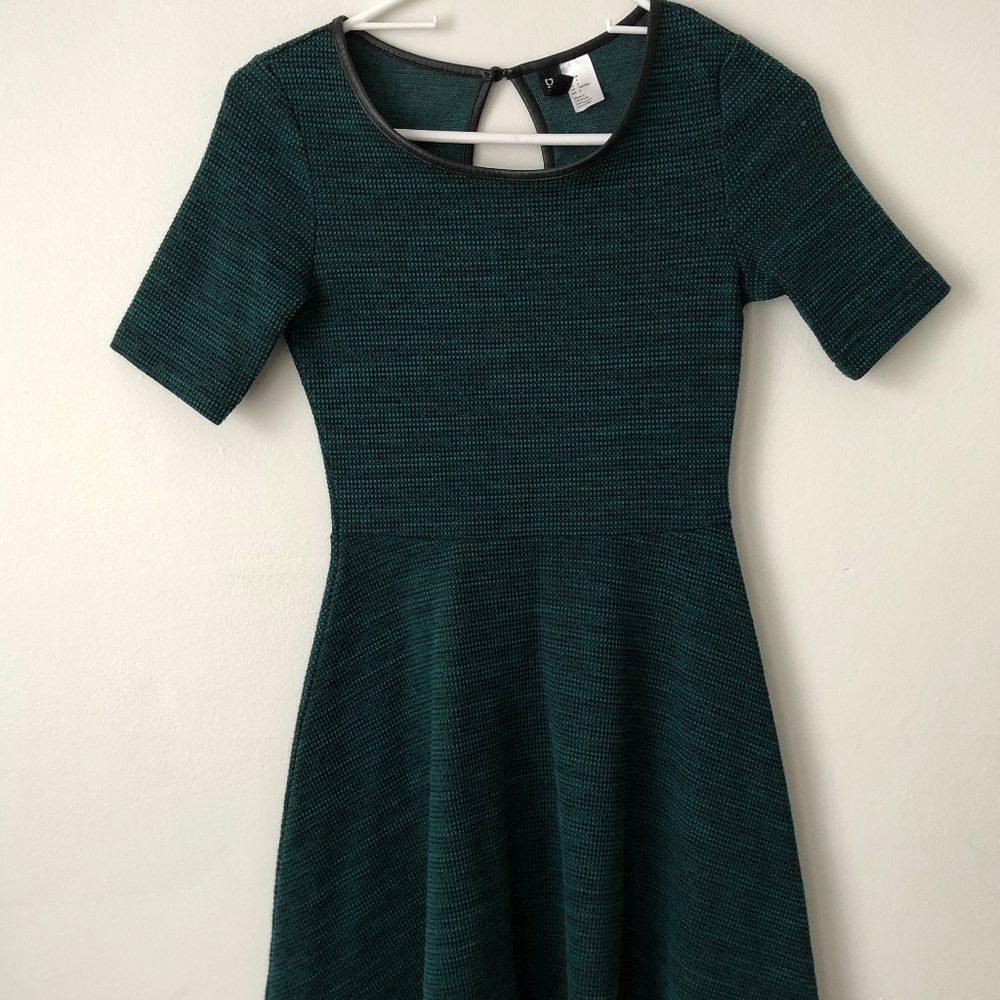 Elegant dark green dress with leather neck lining